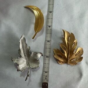 Three vintage leaf pins